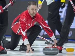 Team Canada skip Brad Gushue follows a rock as they play British Columbia at the Tim Hortons Brier at the Brandt Centre, in Regina on Saturday.