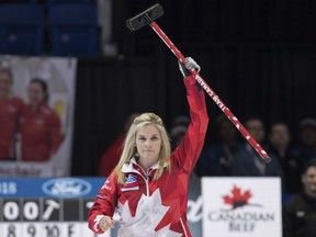 Canada skip Jennifer Jones celebrates her team's victory over United States during the semifinal at the World Women's Curling Championship on Saturday in North Bay, Ont.