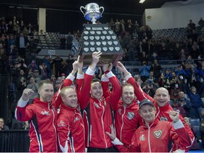 Team Canada skip Brad Gushue, third Mark Nichols, second Brett Gallant, lead Geoff Walker, coach Jules Owchar and alternate Tom Sallows, left to right, hold the Brier Tankard after defeating Alberta 6-4 to win the Tim Hortons Brier at the Brandt Centre in Regina on Sunday, March 11, 2018.They’re the first team to win back-to-back Briers since Kevin Martin in 2008 and 2009.