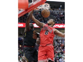 Cleveland Cavaliers forward Jeff Green, left, scores against Chicago Bulls center Cristiano Felicio during the first half of an NBA basketball game Saturday, March 17, 2018, in Chicago.
