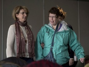 Beth MacLean, right, the woman at the centre of a human rights case dealing with persons with disabilities and their attempts to move out of institutions, and Jo-Anne Pushie, MacLean's former social worker, arrive at the inquiry in Halifax on Tuesday, March 6, 2018.
