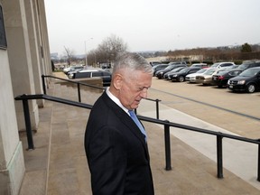 Defense Secretary Jim Mattis, walks to greet President Donald Trump's pick for national security adviser John Bolton, right, as Bolton arrives at the Pentagon, Thursday, March 29, 2018, in Washington.