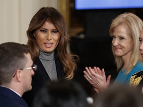 First lady Melania Trump walks from the stage after speaking at the start of the White House Opioid Summit in the East Room of the White House, in Washington, Thursday, March 1, 2018. Second from right is White House senior adviser Kellyanne Conway.