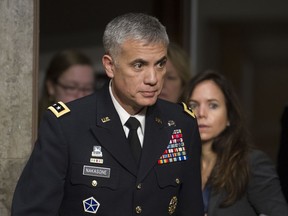 Army Lieutenant General Paul Nakasone arrives at the Senate Armed Services Committee hearing to discuss his qualifications as nominee to be National Security Agency Director and U.S. Cyber Command Commander, on Capitol Hill in Washington, Thursday, March 1, 2018.