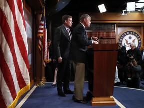 Chairman of the Senate Intelligence Committee Sen. Richard Burr, R-N.C., center, arrives for a news conference with Vice Chairman Sen. Mark Warner, D-Va., left, where they gave a preview of the committee's findings on Russia's hacks of state election systems, Tuesday, March 20, 2018, on Capitol Hill in Washington.