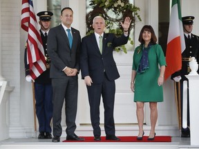 Vice President Mike Pence, center, and his wife wife Karen Pence, right, welcome Prime Minister Leo Varadkar of Ireland, left, to the U.S. Naval Observatory in Washington, Friday, March 16, 2018.