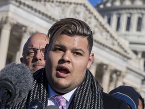 Demitri Hoth, a student at Marjory Stoneman Douglas High School in Parkland, Fla., joined at left by Rep. Ted Deutch, D-Fla., who represents Parkland, join lawmakers and student activists in support of gun control at the U.S. Capitol in Washington, Friday, March 23, 2018, a day before the March for Our Lives rally.