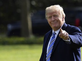 President Donald Trump walks across the South Lawn of the White House in Washington, Friday, March 23, 2018, as he heads to Marine One of a short trip to Andrews Air Force Base. Trump is heading to Florida where he will spend the weekend at the Mar-a-Lago estate.