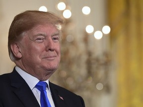 President Donald Trump attends a Greek Independence Day Celebration reception in the East Room of the White House in Washington, Thursday, March 22, 2018.