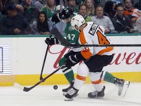 Dallas Stars right wing Alexander Radulov (47) battles Philadelphia Flyers defenseman Andrew MacDonald (47) for the puck during the first period of an NHL hockey game in Dallas, Tuesday, March. 27, 2018.
