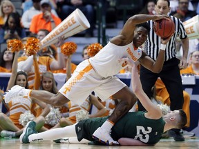 Tennessee forward Admiral Schofield (5) grabs a loose ball over Wright State center Parker Ernsthausen (22) in the second half of a first-round game in the NCAA college basketball tournament in Dallas, Thursday, March 15, 2018.