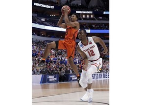 Florida guard KeVaughn Allen (5) goes to the basket in front of Texas Tech guard Keenan Evans (12) during the first half of a second-round game at the NCAA men's college basketball tournament in Dallas, Saturday, March 17, 2018.