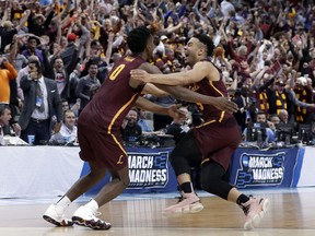 Loyola-Chicago guard Donte Ingram (0) and Marques Townes, right, celebrate their 64-62 win over Miami in a first-round game at the NCAA college basketball tournament in Dallas, Thursday, March 15, 2018.