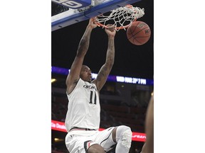 Cincinnati forward Gary Clark (11) dunks the ball during the first half of an NCAA college basketball game against Memphis in the semifinals at the American Athletic Conference tournament Saturday, March 10, 2018, in Orlando, Fla.