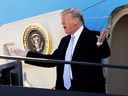President Donald Trump steps off Air Force One after arriving in St. Louis for a fundraiser on Wednesday, March 14, 2018.