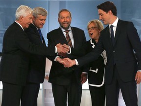 Bloc Québécois Leader Gilles Duceppe, left to right, Conservative Leader and prime minister Stephen Harper, New Democratic Party Leader Thomas Mulcair, Green Party Leader Elizabeth May and Liberal Leader Justin Trudeau shake hands prior to the start of a French-language leaders' debate in Montreal on Sept. 24, 2015.