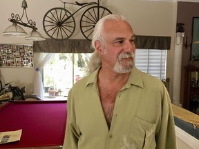 This Thursday, March 1, 2018 photo, shows historian Jeff Schwartz at his home in Parkland, Fla. Parkland's historians and city officials are aiming to save mementos left at the vast makeshift shrines in the aftermath of a Florida high school shooting that killed 17 people. Parkland city's historian Schwartz is setting a plan in motion to collect, archive and preserve the Marjory Stoneman Douglas mementos. Meanwhile, school administrators have vowed to build a memorial after the demolition of the building where the Feb. 14 attack took place.