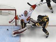 Pittsburgh Penguins' Evgeni Malkin scores past Calgary Flames goaltender Jon Gillies on March 5, 2018.