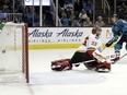 Justin Braun of the Sharks scores past Calgary Flames goaltender David Rittich during the third period of their game Saturday in San Jose, Calif.