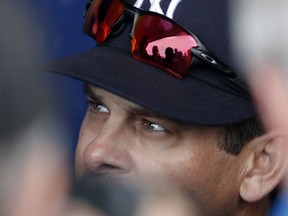 New York Yankees manager Aaron Boone speaks with reporters in the dugout before a spring training baseball game against the New York Mets, Wednesday, March 7, 2018, in Port St. Lucie, Fla.