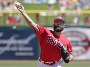 Philadelphia Phillies starting pitcher Jake Arrieta throws in the first inning of a spring baseball exhibition game against the Pittsburgh Pirates, Tuesday, March 27, 2018, in Clearwater, Fla.