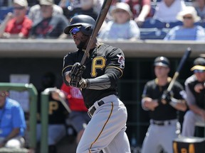 Pittsburgh Pirates' Starling Marte hits a single against the Philadelphia Phillies in the first inning of a spring baseball exhibition game, Tuesday, March 27, 2018, in Clearwater, Fla.