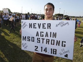 Owen Williams, a student at Coral Glades High School takes part in the March For Our Lives-Parkland event, Saturday, March 24, 2018, in Parkland, Fla.