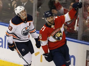 Florida Panthers center Vincent Trocheck (21) celebrates his second period goal in front Edmonton Oilers center Ryan Nugent-Hopkins (93) during an NHL hockey game, Saturday, March 17, 2018, in Sunrise, Fla.