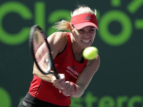 Angelique Kerber, of Germany, returns to Johanna Larsson, of Sweden, during the Miami Open tennis tournament, Thursday, March 22, 2018, in Key Biscayne, Fla.