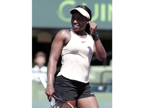 Sloane Stephens celebrates after defeating Garbine Muguruza, of Spain, during the Miami Open tennis tournament, Monday, March 26, 2018, in Key Biscayne, Fla. Stephens won 6-3, 6-4.