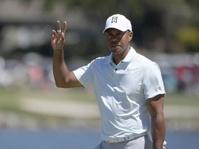 Tiger Woods acknowledges the gallery after making a putt for birdie on the sixth green during the third round of the Arnold Palmer Invitational golf tournament Saturday, March 17, 2018, in Orlando, Fla.