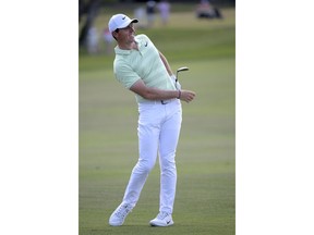 Rory McIlroy, of Northern Ireland, reacts to his shot after hitting from the third fairway during the final round of the Arnold Palmer Invitational golf tournament Sunday, March 18, 2018, in Orlando, Fla.