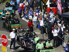 IndyCars are towed to the paddock before the start of the morning practice session on the first day of the Firestone Grand Prix of St. Petersburg Friday, March 9, 2018.