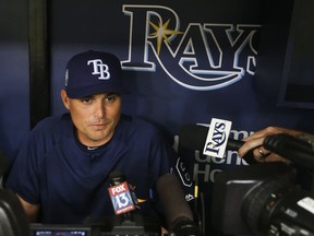 Tampa Bay Rays manager Kevin Kash talks with reporters at Tropicana Field, Wednesday, March 28, 2018, in St. Petersburg, Fla. The Rays host the Boston Red Sox on opening day Thursday.