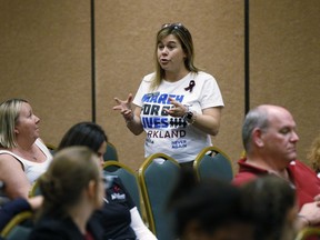 In this, Wednesday, March 14, 2018 photo, Rabbi Melissa Stollman of congregation Kol Tikvah, offer help for the Parkland, Fla., march, during a planning meeting with Marjory Stoneman Douglas High School students, parents and volunteers in a hotel meeting room in Coral Springs, Fla.  The students from Marjory Stoneman Douglas High School have spearheaded what could become one of the largest marches in history. Organizers say they are expecting perhaps 1 million people in the nation's capital Saturday, March 24. More than 800 sister marches are planned from California to Japan.