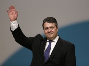 FILE - In this Dec. 11, 2015 file photo German Foreign Minister Sigmar Gabriel waves to the delegates as he receives the applause after his speech during the Social Democratic party convention in Berlin.