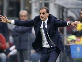 FILE - In this Saturday, Oct. 28, 2017 file photo, Juventus coach Massimiliano Allegri gestures to his players from the sidelines during a Serie A soccer match between AC Milan and Juventus, at the Milan San Siro stadium, Italy, Saturday, Oct. 28, 2017. Juventus coach Massimiliano Allegri has won the golden bench coaching award voted by his colleagues for last season. In 2016-17, Allegri guided Juventus to a record sixth straight Serie A title, a third straight Italian Cup championship and the Champions League final. Allegri received 19 votes, Gian Piero Gasperini of Atalanta finished second with 11 votes and Maurizio Sarri of Napoli came third with seven. It's the third time Allegri has won the award.