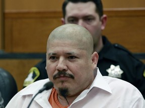 FILE - In this Feb. 9, 2018 file photo, Luis Bracamontes glares at the jury as the verdict is read in the killing of two law enforcement officers, in Sacramento Superior Court in Sacramento, Calif. Bracamontes was found guilty of shooting Sacramento County sheriff's Deputy Danny Oliver in 2014, then killing Placer County sheriff's Detective Michael Davis Jr. hours later. Jurors recommend the death penalty for Bracamontes.