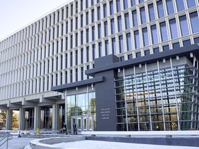 In this Jan. 19, 2007, file photo, visitors leave the James A. McClure Federal Building & United States Courthouse in downtown Boise, Idaho. A federal judge says Idaho can't continue automatically rejecting applications from transgender people seeking to change the gender listed on their birth certificates. The judge said Monday, March 5, 2018, that the state's rules violate the Equal Protection Clause of the U.S. Constitution.