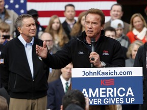 FILE - In this March 6, 2016, file photo, former California Gov. Arnold Schwarzenegger introduces Republican presidential candidate, Ohio Gov. John Kasich during a campaign rally in Columbus, Ohio. Can California's faded Republican Party make a comeback? Schwarzenegger will take up that question Wednesday, March 21, 2018, at an event in Los Angeles organized by a group that hopes to move the GOP in a new direction in the age of President Donald Trump. He'll be joined by another Republican centrist, Kasich, who was a Trump rival in the 2016 presidential campaign.