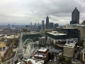 Clouds and wind move through the Atlanta area, Monday, March 19, 2018. More than 29 million people, including millions in Atlanta, face a threat of severe storms that could bring large, damaging winds and strong tornadoes to the southeastern United States, forecasters said.