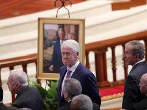 Former presidents from left, Jimmy Carter, Bill Clinton and George W. Bush attend a funeral service for former U.S. senator and former Georgia Gov. Zell Miller in Atlanta on Tuesday, March 27, 2018.
