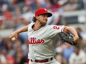 Philadelphia Phillies starting pitcher Aaron Nola works in the first inning of a baseball game against the Atlanta Braves, Thursday, March 29, 2018, in Atlanta.