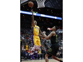 Los Angeles Lakers guard Isaiah Thomas (7) goes up for a shot against Atlanta Hawks guard Kent Bazemore (24) during the second half of an NBA basketball game in Atlanta Monday, Feb. 26, 2018. Los Angeles won 123-104.