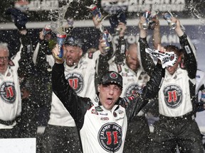 Kevin Harvick (4) reacts after winning the NASCAR Cup Series auto race at Atlanta Motor Speedway in Hampton, Ga., on Sunday, Feb. 25, 2018.