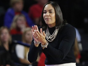 Georgia coach Joni Taylor roots for her team from the bench during the first half of a second-round game against Duke in the NCAA women's college basketball tournament in Athens, Ga., Monday, March 19, 2018.