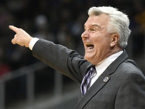 Kansas State head coach Bruce Weber speaks to players during the first half of a regional final NCAA college basketball tournament game against Loyola-Chicago, Saturday, March 24, 2018, in Atlanta.