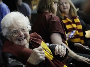 Sister Jean Dolores Schmidt sits with other Loyola-Chicago fans during the first half of a regional semifinal NCAA college basketball game against Nevada, Thursday, March 22, 2018, in Atlanta.