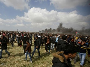 Fifteen people were killed and more than 750 wounded by Israeli fire as thousands of Palestinian protesters marched to Gaza’s border with Israel, the Palestinian Health Ministry said. The Israeli military said that thousands of Palestinians threw stones and rolled burning tires toward troops, that Palestinian gunmen fired toward soldiers in one incident and that militants were trying to conduct attacks under the cover of protests.