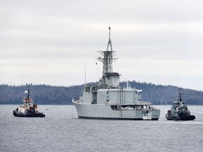 Athabaskan is towed by Atlantic Towing Limited's Atlantic Larch, left, and followed by the navy tug CFAV Glenside, from the harbour in Halifax on Thursday, March 29, 2018. The former Royal Canadian Navy Iroquois-class destroyer, the last of four, is heading to Sydney, N.S. for breaking and recycling. The Iroquois-class as well as the Halifax-class will be replaced by Canadian Surface Combatant warships.